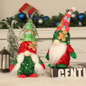 Pair of festive Christmas gnomes with sequin hats and gingerbread man holiday accents