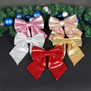 Set of 5 sparkling sequin Christmas bows in red, gold, silver for festive tree decoration.