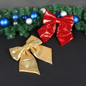 Two festive red and gold Christmas sequin bows for holiday tree and party decoration