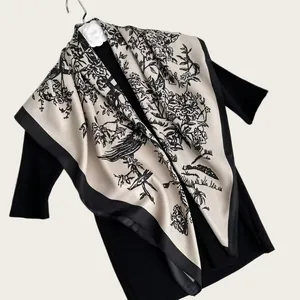 Detailed view of a 90cm twill square scarf with elegant ink wash floral and bird print