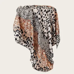 Elegant leopard print patchwork satin square scarf detail showing silky texture and pattern