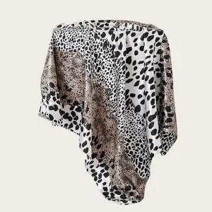 Detail view of 90cm leopard print satin square scarf showing mixed animal patterns