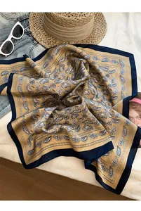 Detailed view of retro paisley pattern on a high-quality silk square scarf accessory