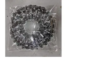 Close-up detail of 42cm Christmas tinsel wreath in transparent plastic packaging bag