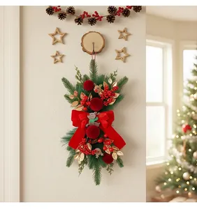 Festive Christmas teardrop wreath with red velvet bow and reindeer details for wall