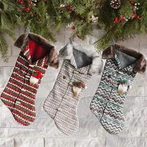Set of 3 knitted Christmas stockings with plush fur trim and cute gnome ornaments.