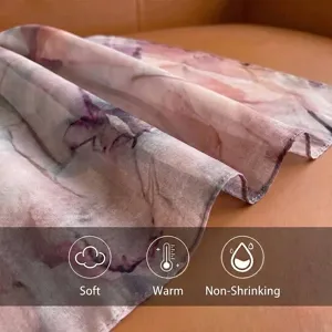Close-up detail of soft rayon scarf featuring an artistic watercolor gradient pattern