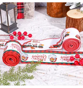 Detailed view of Merry Christmas ribbons with Santa patterns for DIY tree decoration.
