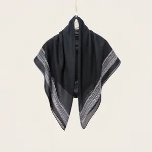 Close-up of black 110cm silk cotton square scarf with white floral border pattern