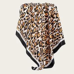 Detailed view of a 90cm leopard print satin square scarf featuring a chic black and white border
