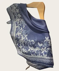 Detail of navy blue square scarf with white hydrangea print and border