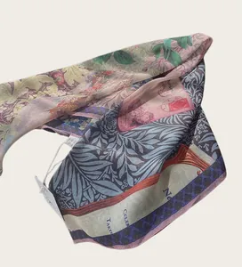 Detailed view of a soft lightweight square scarf with intricate oil painting and floral motifs.
