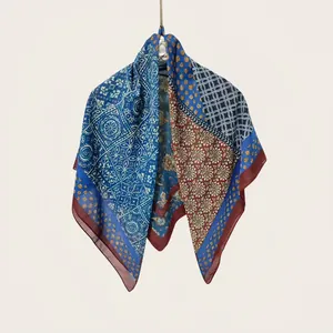 Detailed macro of a Bohemian style silk-cotton square scarf with patchwork patterns