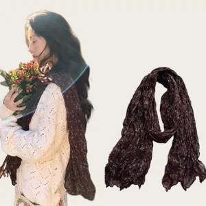 Detailed display of a lightweight pleated burgundy floral cotton linen long scarf for women