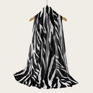 Zebra striped rayon scarf detail showing black and white pattern and soft texture