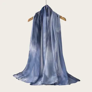 Detail view of a high-quality rayon scarf with a soft blue watercolor gradient effect
