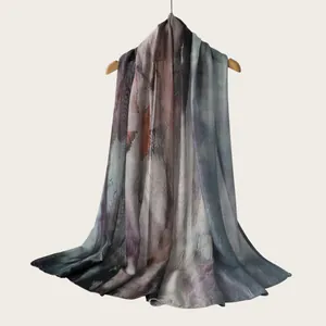 Detailed macro view of watercolor gradient stripe scarf showing soft viscose fabric texture