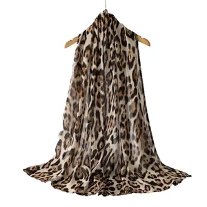 Elegant leopard print viscose scarf with a soft draped texture displayed on a hanger