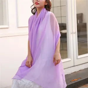 Elegant lavender purple sheer shawl draped over model for summer sun protection