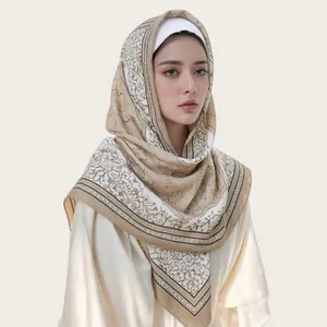 Close-up of elegant floral print voile hijab showing delicate scroll patterns