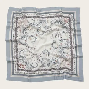 Detailed view of the elegant floral print and baroque patterns on the voile square scarf.