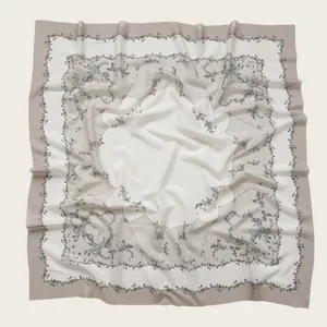 Elegant square voile scarf featuring intricate floral prints and delicate scalloped borders
