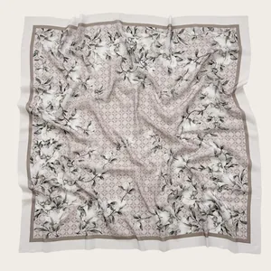 Elegant floral print square hijab with delicate petal patterns and soft draped voile fabric