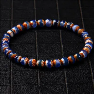 Close-up of 6mm multi-color stone beaded bracelet with blue and orange textures.