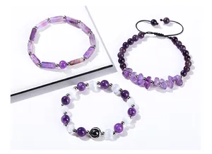 Detail of three varied natural amethyst bead and chip bracelets on white background