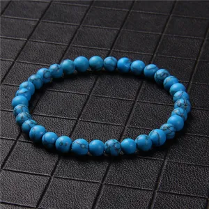 Close-up detail of 6mm blue marbled stone beads on a single-strand unisex bracelet.
