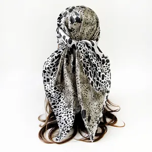 Leopard print satin silk headscarf tied on hair macro view detail exhibition