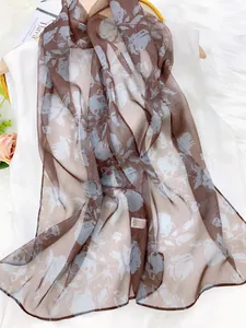 Detail view of lightweight floral chiffon scarf for women's neckerchief