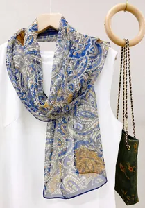 Close-up of elegant blue and yellow paisley pattern chiffon silk scarf on hanger