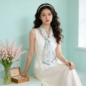 Model wearing a delicate floral georgette silk scarf as a French style neck accessory