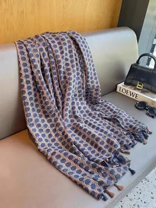 Elegant lightweight summer shawl with blue polka dot pattern and tassels for women