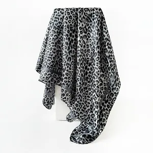 Detail view of grey leopard print satin square scarf with elegant drape and sheen.