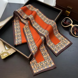 Élégante écharpe étroite en soie orange et marron avec motif ornemental géométrique