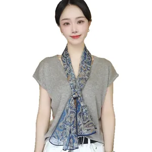 Elegant paisley print thin silk scarf for women shown on a model against white background