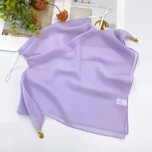 Close-up of a breathable purple sun protection face mask scarf with golden charms