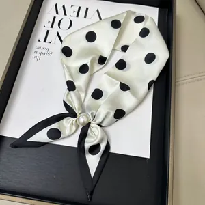 Elegant white polka dot scarf featuring a large faux pearl magnetic buckle closure