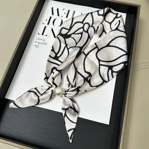 Elegant white silk-like scarf with black line pattern and pearl magnetic buckle