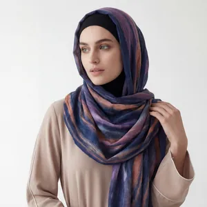 Close-up detail of the gradient crinkle striped viscose hijab on a female model