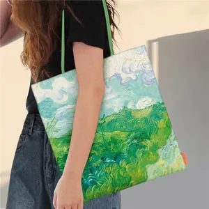 Close-up detail of a model carrying a Van Gogh oil painting style canvas tote bag.