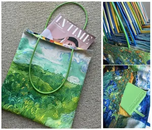 Detailed macro view showing the vibrant Van Gogh oil painting print and internal pocket of the tote bag