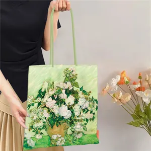 Detailed view of Van Gogh Roses oil painting print on a large canvas tote bag.