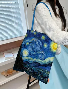 Detailed view of canvas tote bag featuring Van Gogh's Starry Night oil painting.