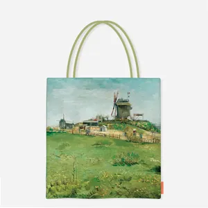 Detailed view of canvas tote bag featuring Van Gogh oil painting print and green handles