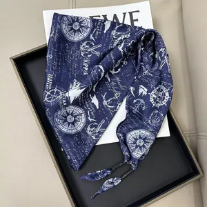 Navy blue nautical print triangular scarf with compass and anchor patterns