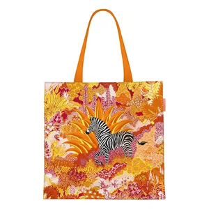 Vibrant zebra jungle print canvas tote bag with orange handles for casual daily use