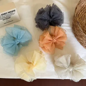 Close-up detail showing a set of five Korean mesh bow hair clips in various pastel colors.